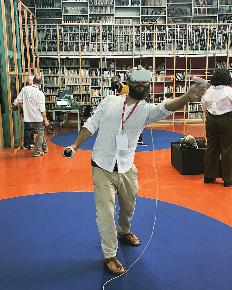 A person using a VR headset in the library at the University of Torino, Italy.